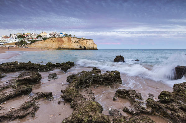 Sunset on the village of Carvoeiro surrounded by sandy beach and clear sea Lagoa Municipality Algarve Portugal Europe