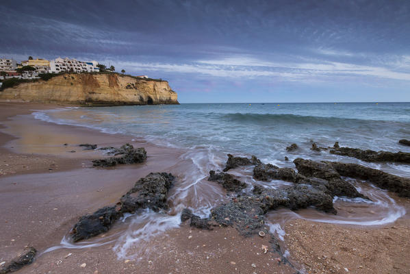 Sunset on the village of Carvoeiro surrounded by sandy beach and clear sea Lagoa Municipality Algarve Portugal Europe