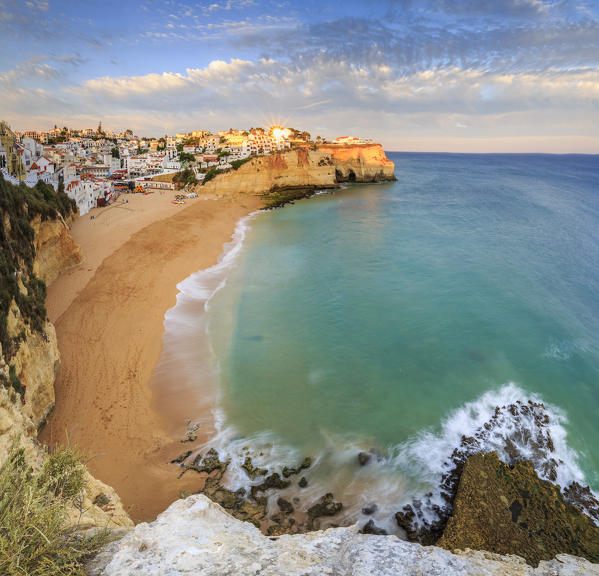 Panoramic view of Carvoeiro village surrounded by sandy beach and clear sea at sunset Lagoa Municipality Algarve Portugal Europe