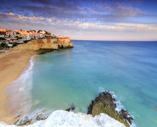 Panoramic view of Carvoeiro village surrounded by sandy beach and clear sea at sunset Lagoa Municipality Algarve Portugal Europe