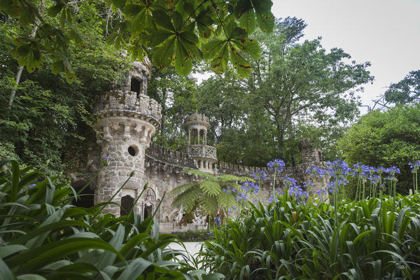 Mystical constructions of Romanesque Gothic and Renaissance style inside the park Quinta da Regaleira Sintra Portugal Europe