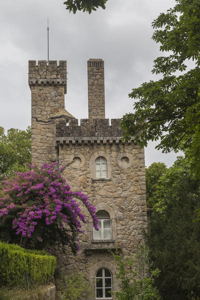 Old mystical buildings of Romanesque Gothic and Renaissance style inside the park Quinta da Regaleira Sintra Portugal Europe