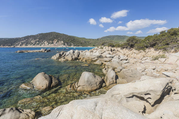Cliffs and rocks frame the turquoise sea around the sandy beach of Cala Pira Castiadas Cagliari Sardinia Italy Europe