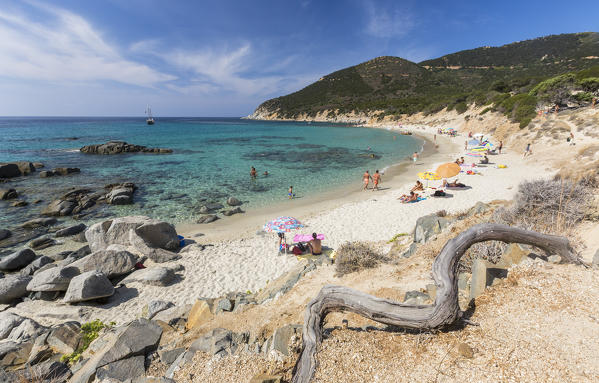 Tourists on the sandy beach of Porto Sa Ruxi surrounded by the turquoise sea Villasimius Cagliari Sardinia Italy Europ