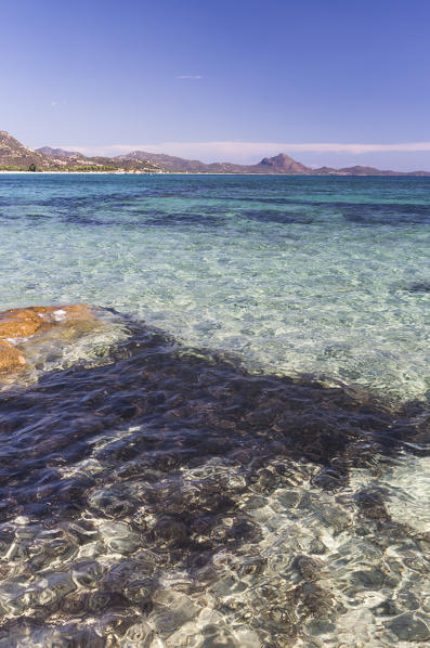 Rocks frame the turquoise water of sea around the sandy beach of Sant Elmo Castiadas Costa Rei Cagliari Sardinia Italy Europe