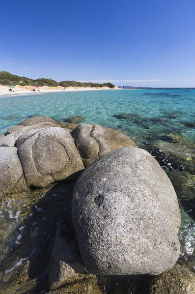 Rocks frame the turquoise water of sea around the sandy beach of Sant Elmo Castiadas Costa Rei Cagliari Sardinia Italy Europe