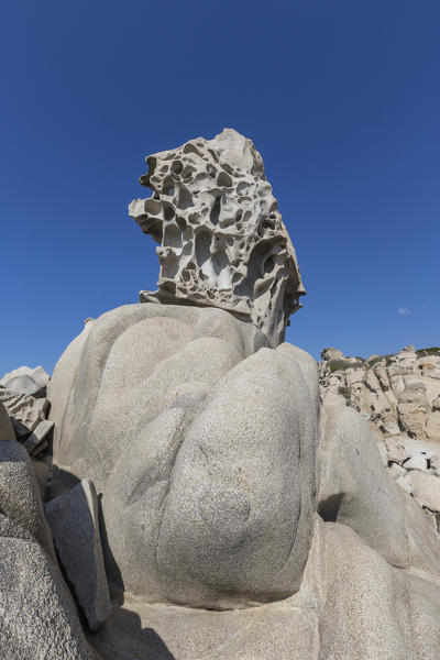 The sun shines on the white rocks eroded by wind framing the blue sky Punta Molentis Villasimius Cagliari Sardinia Italy Europe