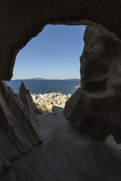 View of the blue sea from a natural sea cave of rocks shaped by wind Punta Molentis Villasimius Cagliari Sardinia Italy Europe