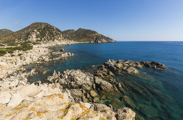 View of cliffs and headlands surrounding the turquoise sea Punta Molentis Villasimius Cagliari Sardinia Italy Europe
