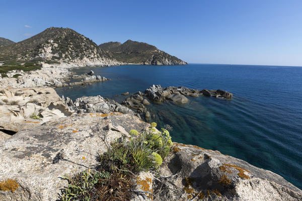 View of cliffs and headlands surrounding the blue sea Punta Molentis Villasimius Cagliari Sardinia Italy Europe