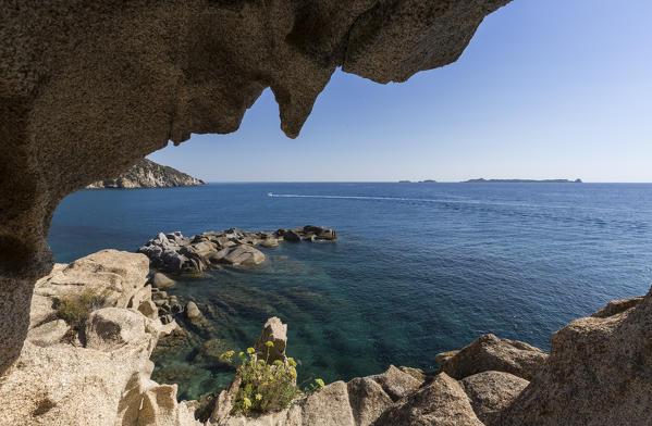 View of the blue sea from a natural sea cave of rocks shaped by wind Punta Molentis Villasimius Cagliari Sardinia Italy Europe