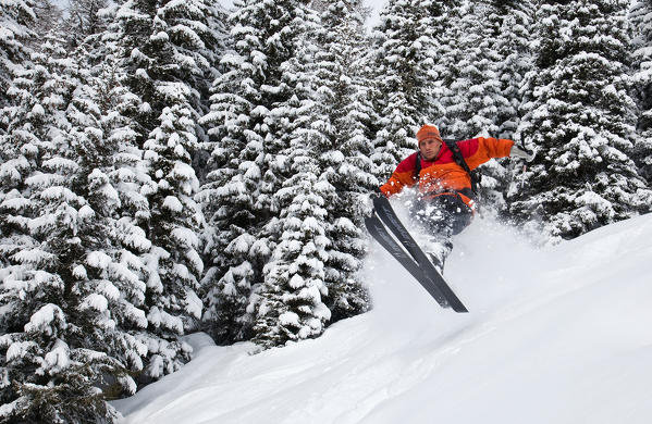 A skier jumping in the Orobie Alps after a heavy snowfall, Valtellina, Lombardy Italy Europe