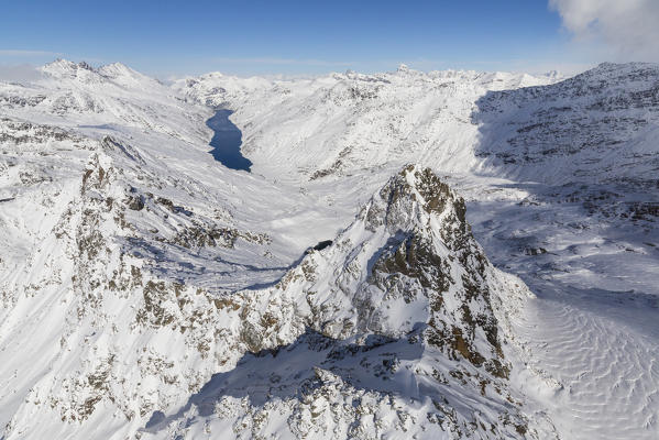 Aerial view of snowy Peak Peloso surrounded by Lago di Lei Val di Lei Chiavenna Spluga Valley Valtellina Lombardy Italy Europe