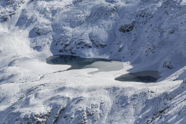 Aerial view of Lakes of Stella framed by snowy peaks Val di Lei Chiavenna Spluga Valley Valtellina Lombardy Italy Europe