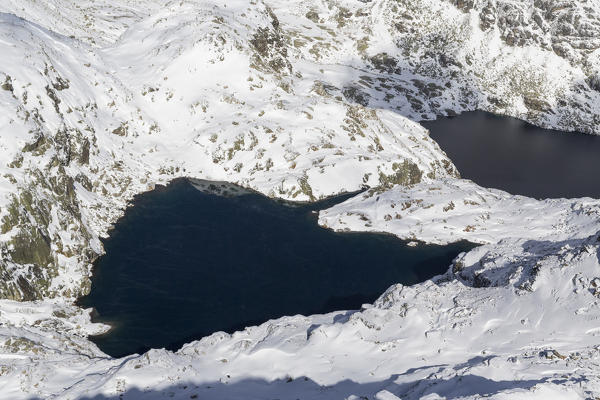 Aerial view of the blue alpine lakes framed by snowy peaks Truzzo Valley Spluga Valley Valtellina Lombardy Italy Europe