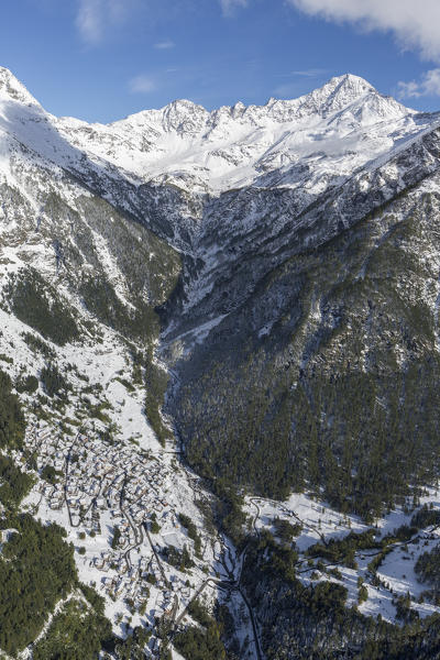 Aerial view of the snowy village of Fraciscio and Peak Stella Spluga Valley Valtellina Lombardy Italy Europe
