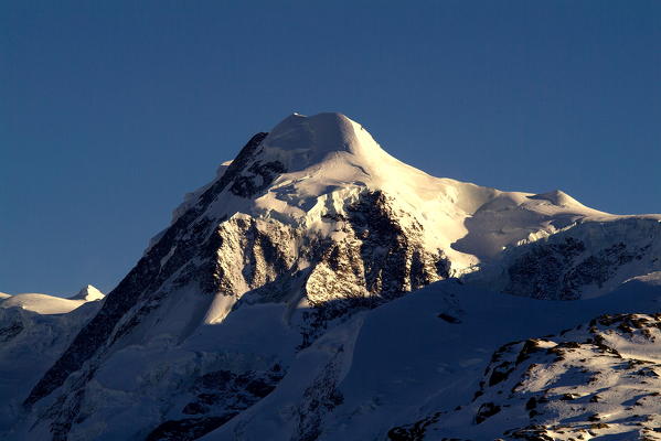 The summit of the Pollux in the Mount Rosa Group at sunset, in the Canton of Valais, Switzerland Europe