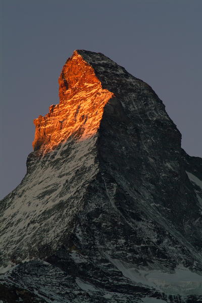 The typical shape of the summit of the Matterhorn at sunrise from the valley of Zermatt, Canton of Valais, Switzerland Europe