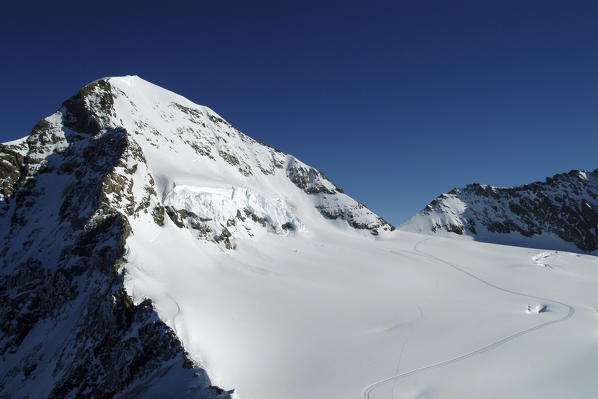 The south face of the Monch in the Jungfrau group. Its summit rises above 4.000 m in the Bernese Alps, Switzerland Europe