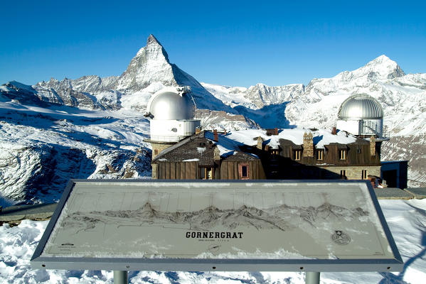 Plaque with the names of the peaks by the Gornergrat station. In the background the Matterhorn top and the Dent Blanche on the right, canton of Valais, Switzerland Europe