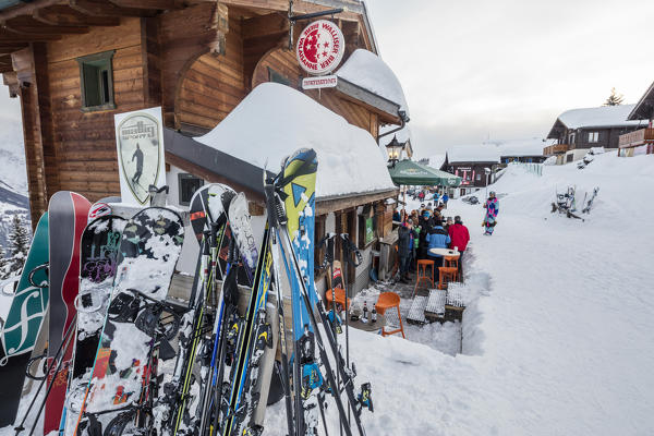 Skiers having a break at cafe of the typical alpine village Bettmeralp district of Raron canton of Valais Switzerland Europe