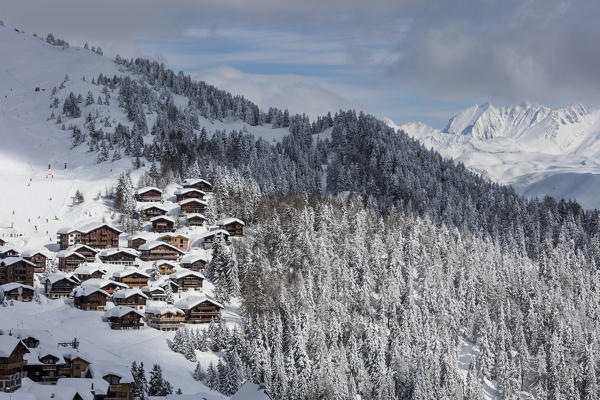 Snowy woods frame the typical alpine village and ski resort Bettmeralp district of Raron canton of Valais Switzerland Europe