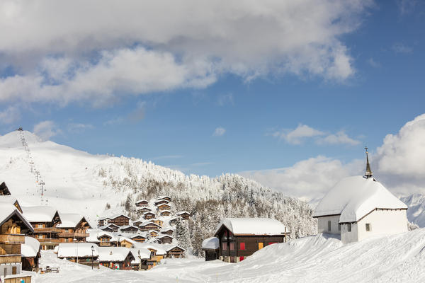 View of the alpine village surrounded by snow and its sky area Bettmeralp district of Raron canton of Valais Switzerland Europe