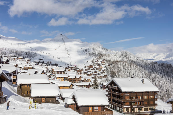 Snowy woods frame the typical alpine village and ski resort Bettmeralp district of Raron canton of Valais Switzerland Europe