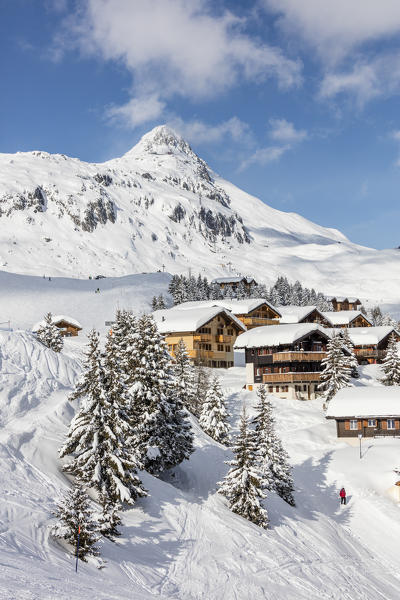 Trees covered with snow frame the typical mountain huts Bettmeralp district of Raron canton of Valais Switzerland Europe