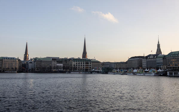 The artificial Inner Alster Lake frames the old buildings and palace of the city center Hamburg Germany Euope