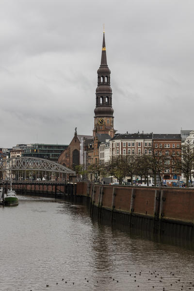 A view to the bell tower and the bridge on the canal Hamburg Germany Europe