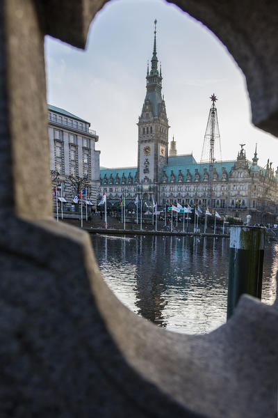 A view to the Neorenaissance bell tower and Town Hall Square reflected in water Rathaus Altstadt quarter Hamburg Germany Europe