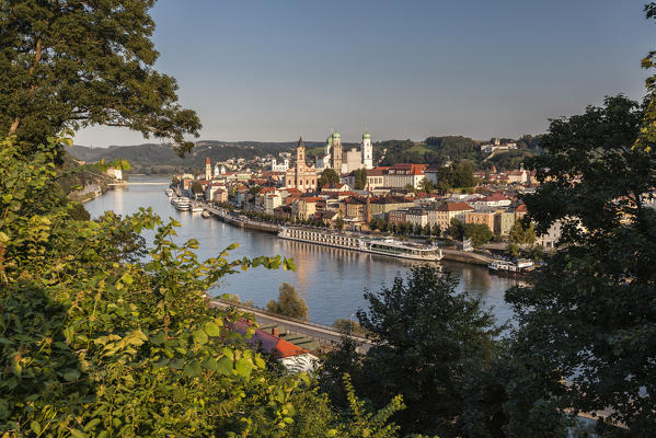 Top view of the typical buildings and houses set among green hills and river Passau Lower Bavaria Germany Europe