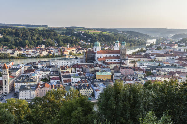 Top view of the typical buildings and houses set among green hills and river Passau Lower Bavaria Germany Europe