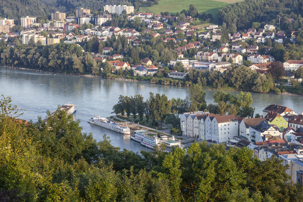 Top view of the typical buildings and houses set among green hills and river Passau Lower Bavaria Germany Europe