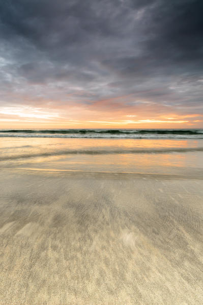 The midnight sun is reflected on the sandy beach of Skagsanden Ramberg Nordland county Lofoten Islands Northern Norway Europe