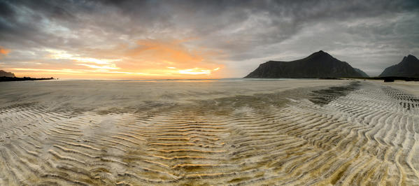 Panoramic of sandy beach illuminated by midnight sun Skagsanden  Ramberg Nordland county Lofoten Islands Northern Norway Europe