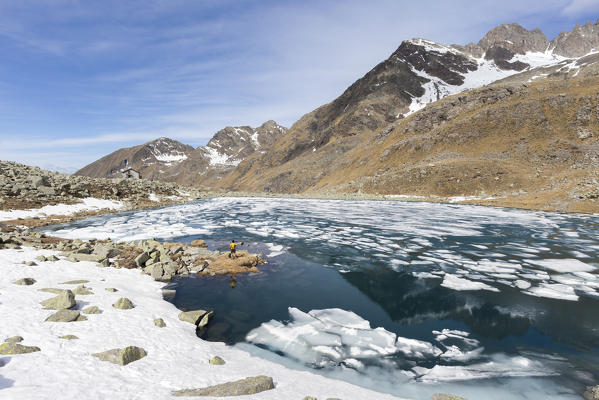 Ice and clear water at Lago Rotondo during thaw Val Malga Adamello Regional Park province of Brescia Lombardy Italy Europe