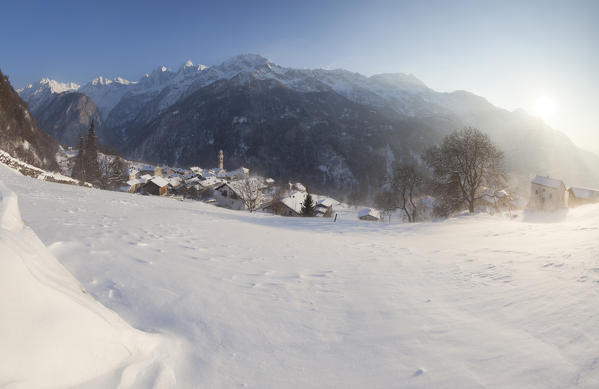 Sunset on the snowy village of Soglio canton of Graubünden Maloja District Bregaglia Valley Engadine Switzerland Europe