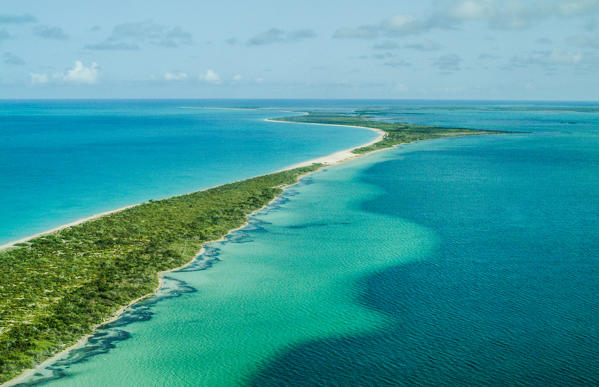 Aerial shot of Codrington Lagoon, a long lagoon which takes up much of the west of the Caribbean island of Barbuda. Its access to the sea is via Cuffy Creek, at the northern tip of the lagoon. The water is shallow, and much of the shore of the northern half of the lagoon is marshland - Antigua and Barbuda West Indies