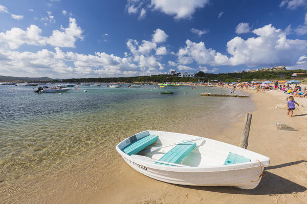 Boat on the sandy beach frames the turquoise sea Capo Testa Santa Teresa di Gallura Province of Sassari Sardinia Italy Europe