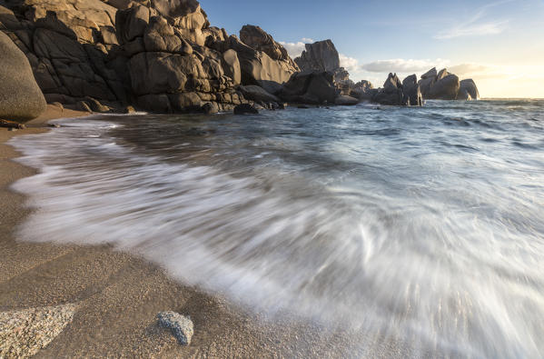Waves crashing on the sandy beach framed by cliffs Capo Testa Santa Teresa di Gallura Province of Sassari Sardinia Italy Europe