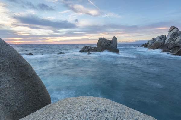 The light of sunset on blue sea framed by cliffs Capo Testa Santa Teresa di Gallura Province of Sassari Sardinia Italy Europe