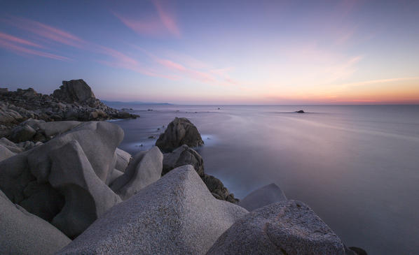 Sunset on modeled cliffs by wind framing blue sea Capo Testa Santa Teresa di Gallura Province of Sassari Sardinia Italy Europe
