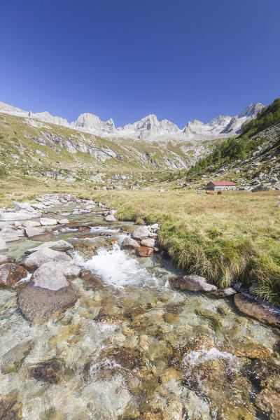 Clear water of creek frames the high peaks Porcellizzo Valley Masino Valley Valtellina  Sondrio Province Lombardy Italy Europe