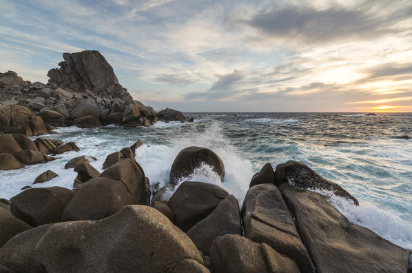 Sunset on modeled cliffs by wind framing blue sea Capo Testa Santa Teresa di Gallura Province of Sassari Sardinia Italy Europe