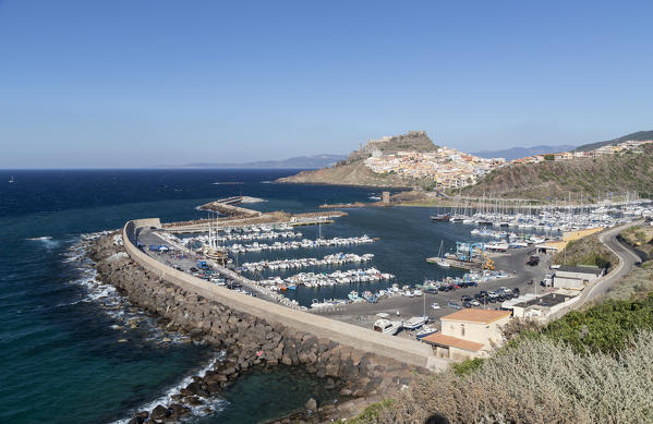 View of the coastal town and harbour framed by blue sea Castelsardo Gulf of Asinara Province of Sassari Sardinia Italy Europe