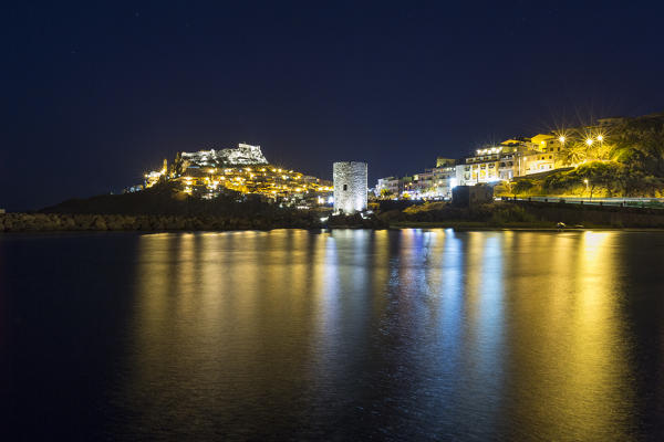 Night view of village on promontory and its medieval tower Castelsardo Gulf of Asinara Province of Sassari Sardinia Italy Europe