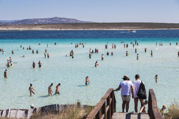 Bathers in the turquoise sea La Pelosa Beach Stintino Asinara National Park Province of Sassari Sardinia Italy Europe