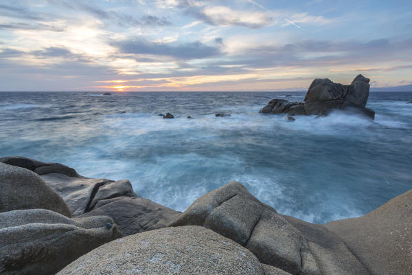 The light of sunset on blue sea framed by cliffs Capo Testa Santa Teresa di Gallura Province of Sassari Sardinia Italy Europe